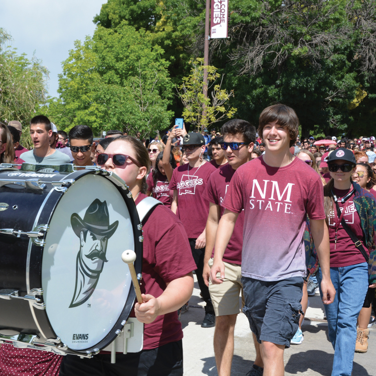 Student walking down the internationall mall at a Frist Walk event.